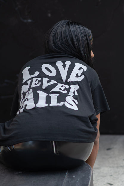 LOVE NEVER FAILS GRAPHIC TEE